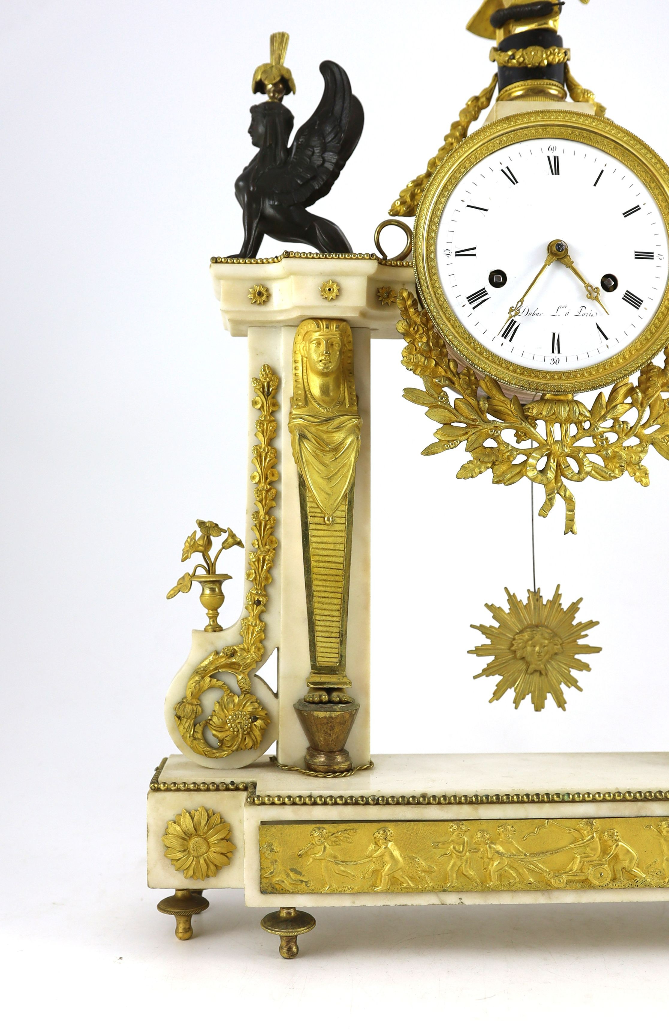 Jean Baptiste Dubuc L'ne à Paris. A Louis XVI bronze and ormolu mounted white marble mantel clock, width 43cm, depth 11cm, height 60cm